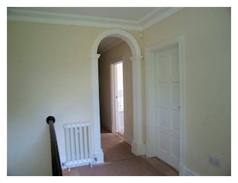 Full 90 degree arch with flat hand pilister replacing a door..